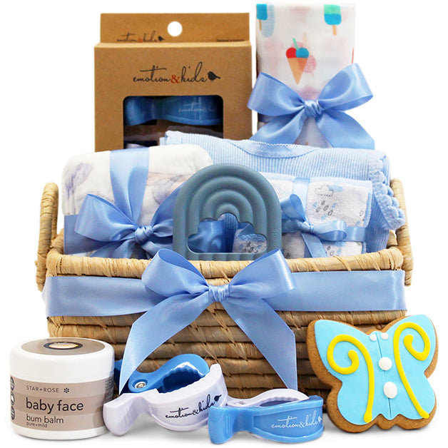 Blue baby essentials gift basket in a handmade Madagascan basket with ribbon