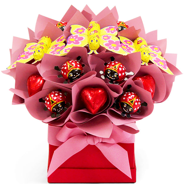 Love Bug chocolate bouquet with Chocolatier hearts, ladybugs and butterflies in a red box