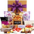 Little Nibbles gift hamper with biscuits, chocolates and snacks in a black gift box