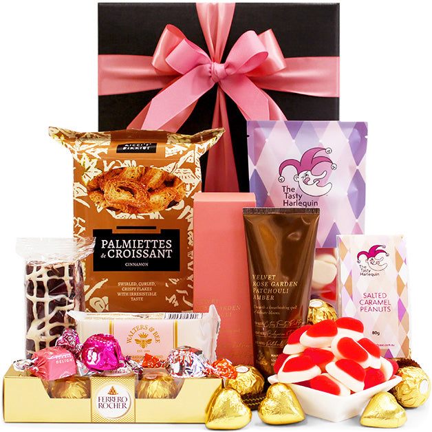Spoil Mum gift hamper with hand cream, chocolates and sweet treats in a black gift box